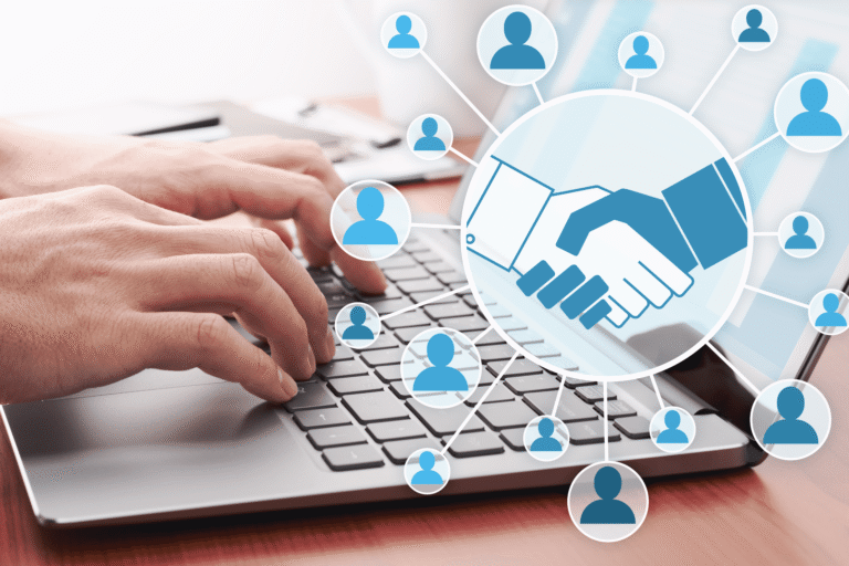 Hands typing on a laptop overlaid with a handshake icon linked to a network of contact icons